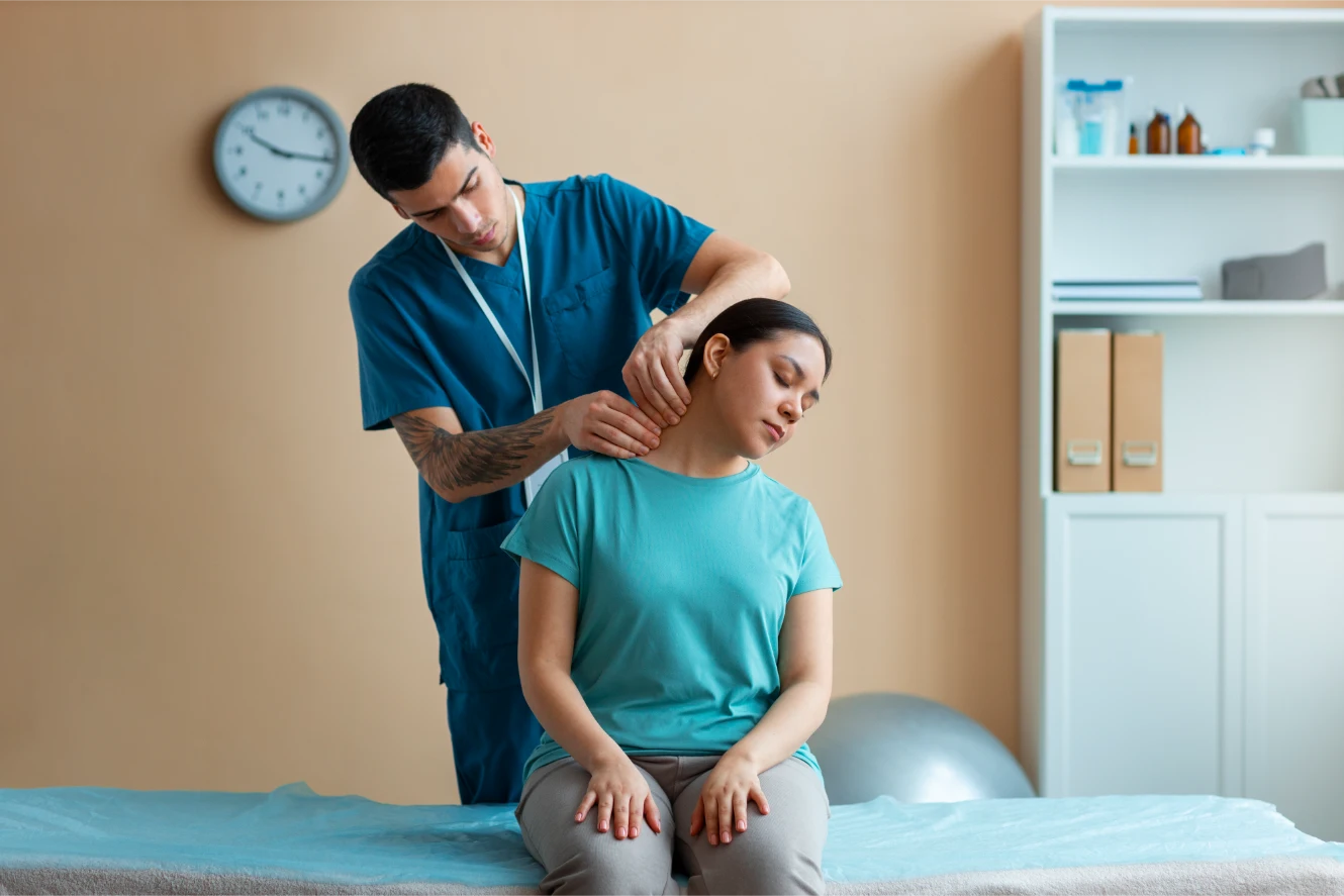 Infinite Healing Center clinician evaluating or treating a patient for back pain in Mesa AZ